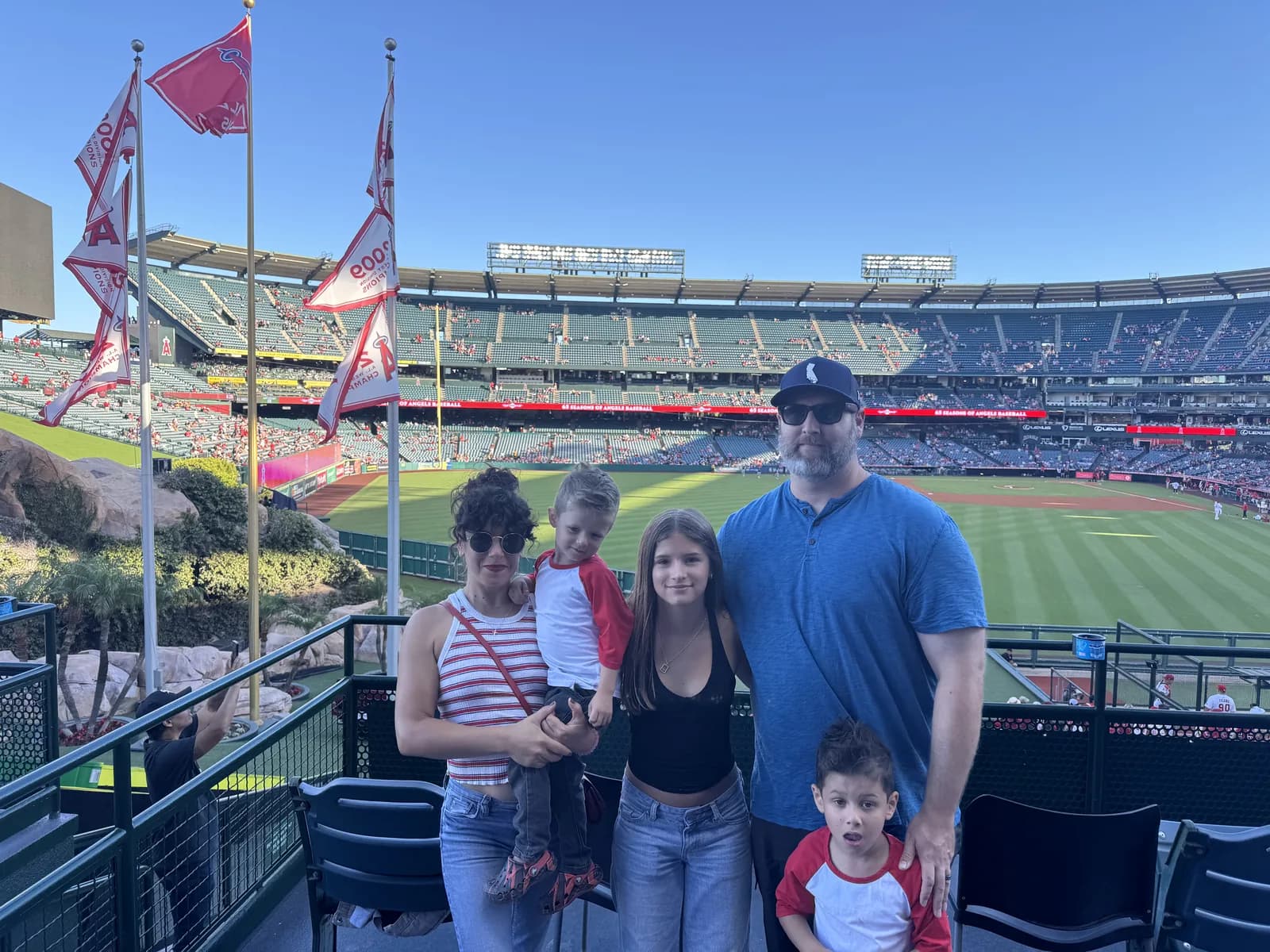 My whole family at Angel Stadium, the field spread out behind us.